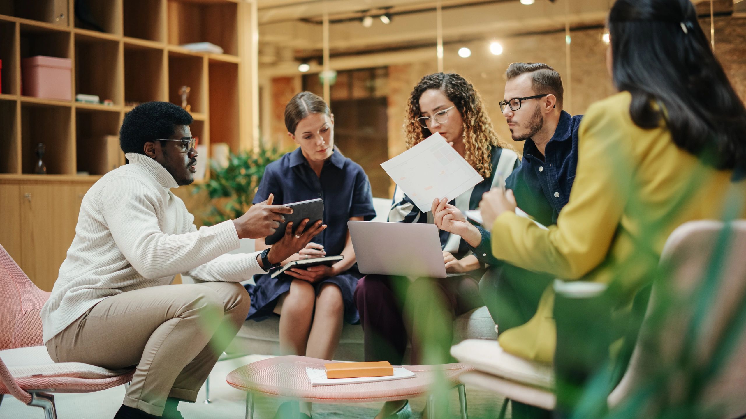 Project team coordinating work in a meeting