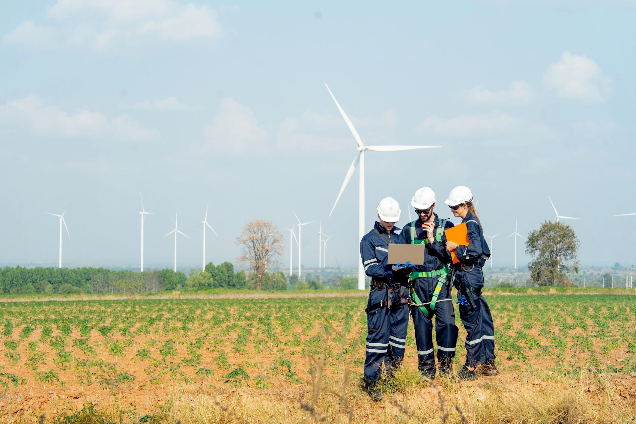 Technicians working outdoors on infrastructure planning