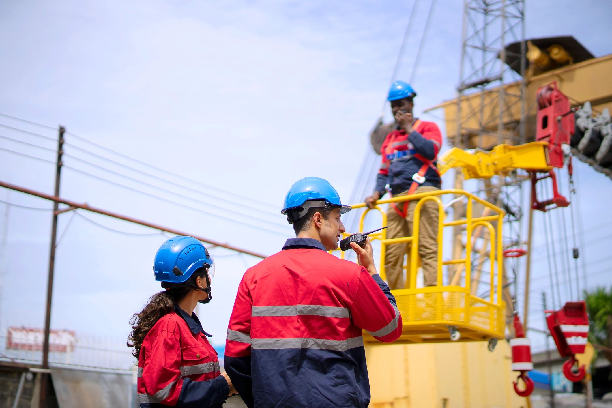 Telecom field team reviewing work at an active project site