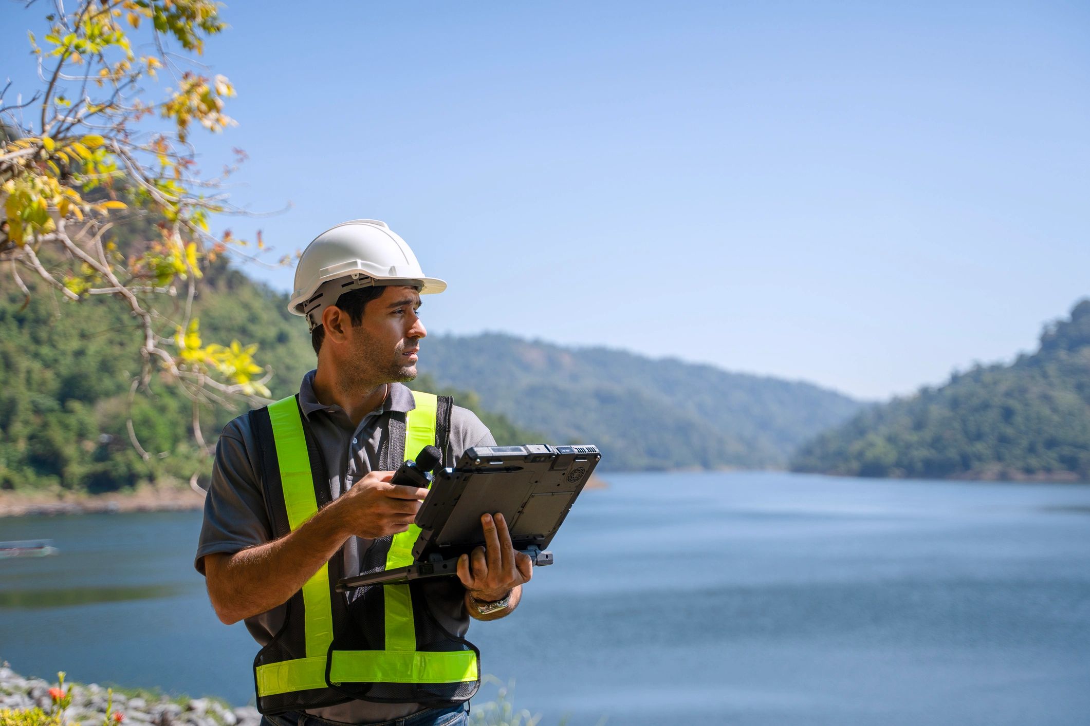 Worker performing field installation tasks