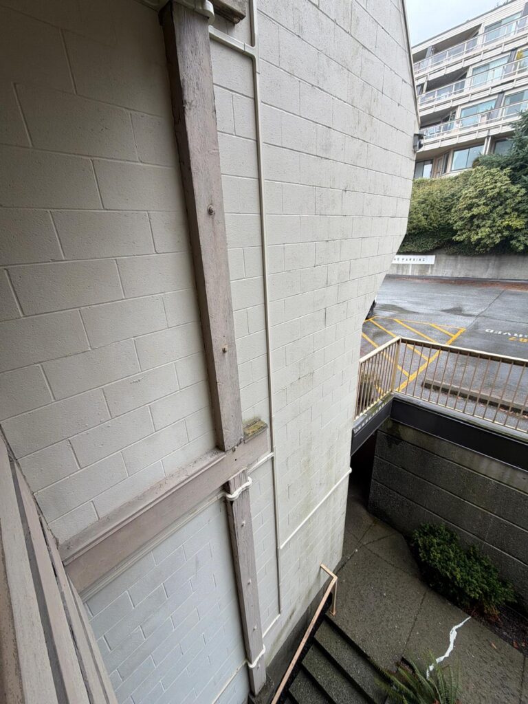Outdoor fiber raceway along building exterior wall