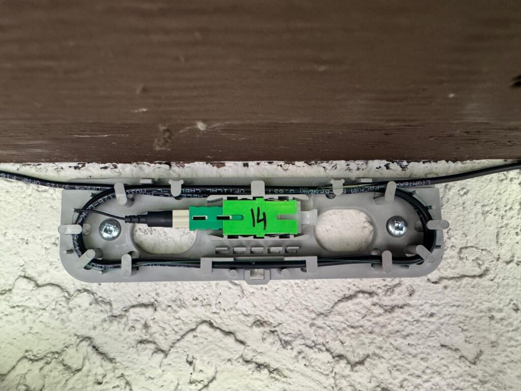 Outdoor fiber splice closure with green SC connectors